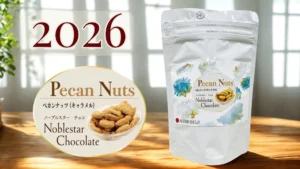 アイスター商事の「ノーブルスターチョコ ペカンナッツ(キャラメル)」2026の商品画像。 【冬のティータイムに、ささやかな彩りを】 忙しい日々の合間に、ほっと心がほどけるひとときをイメージした画像です。